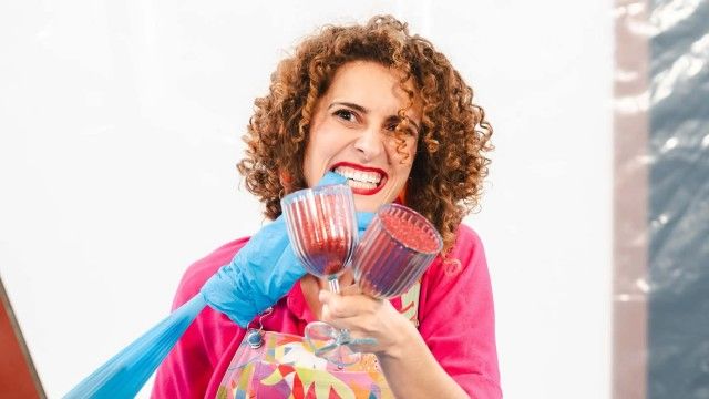 A donkey milking a cow