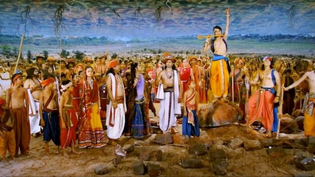 Krishna lifts the Govardhan hill