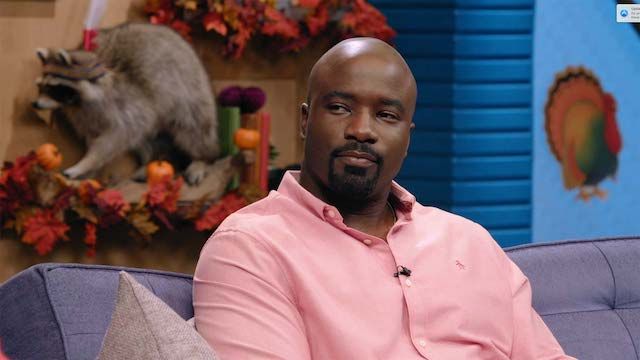Mike Colter Wears a Pink Button Up and Black Boots