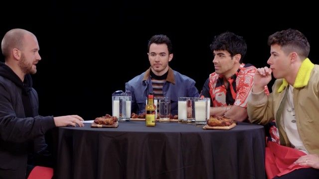 The Jonas Brothers Burn Up While Eating Spicy Wings