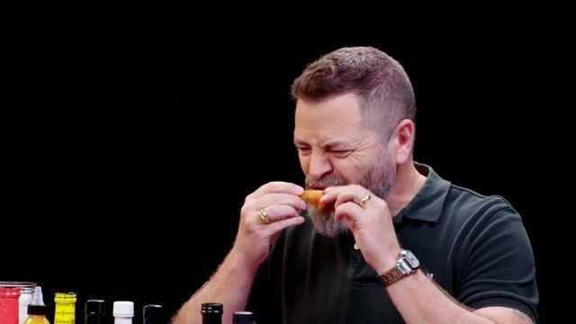 Nick Offerman Gets the Job Done While Eating Spicy Wings